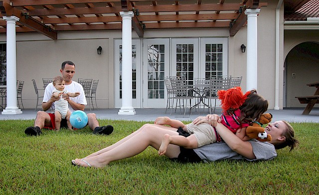 Christine Garcia plays with her daughter, Mikaelah, as her husband, John, and son Jordan play together in the back yard of the Fisher House on Tuesday, May 24, 2011. 